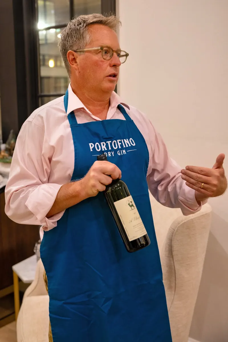 Wine professional presenting a bottle of wine