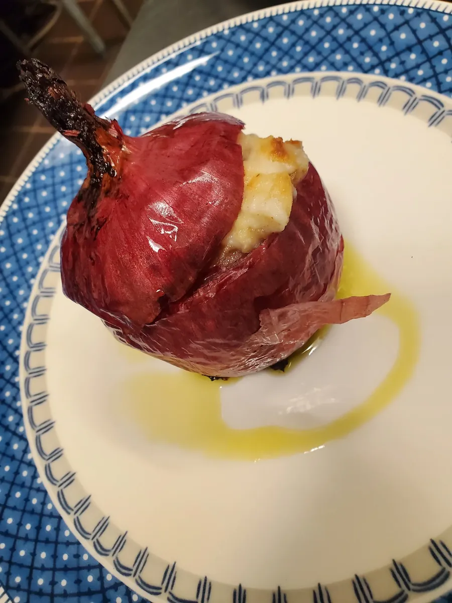 Roasted onion on a blue-rimmed plate