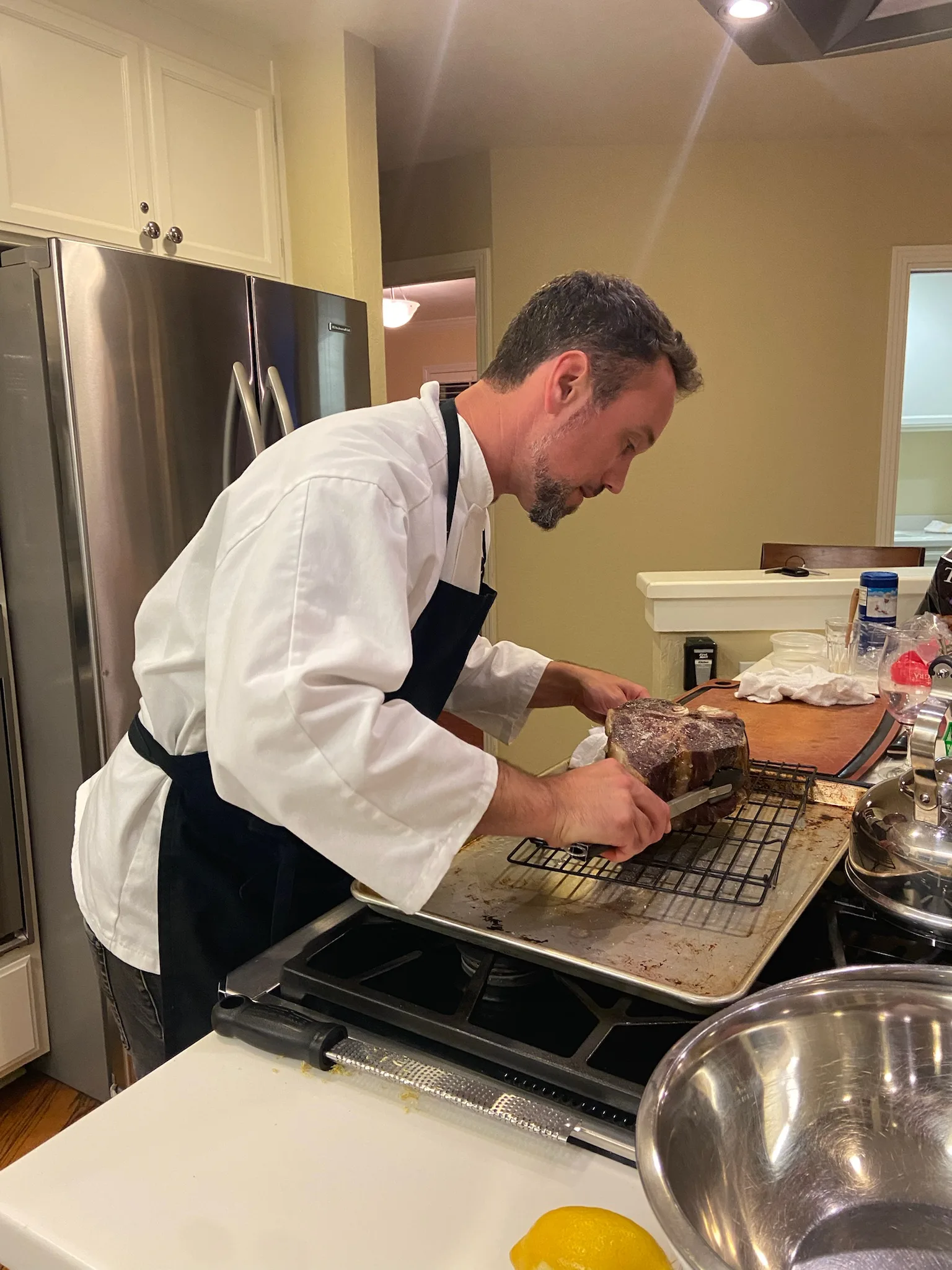 Chef finishing steak preparation at a Napa Valley private dinner