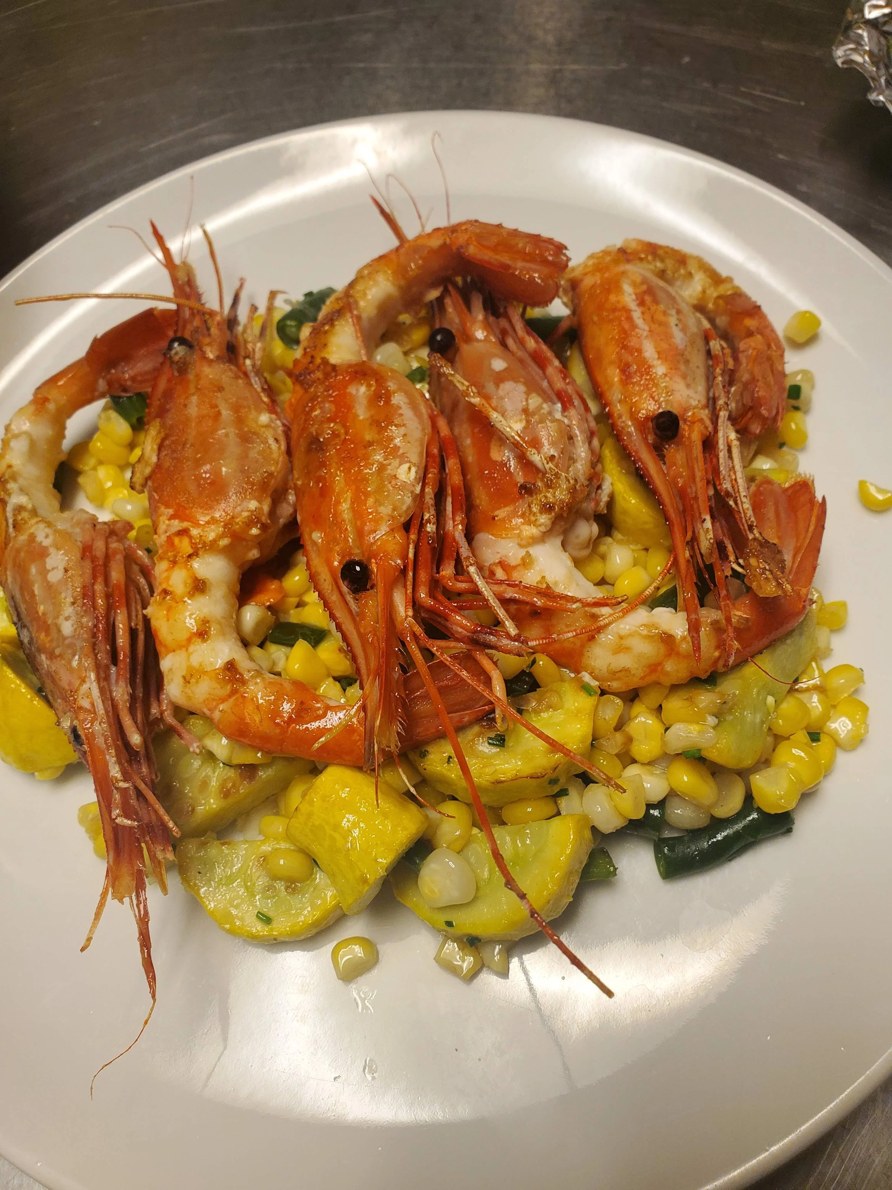 Pan-seared Pacific prawns over summer corn and squash succotash at a Napa Valley private dinner