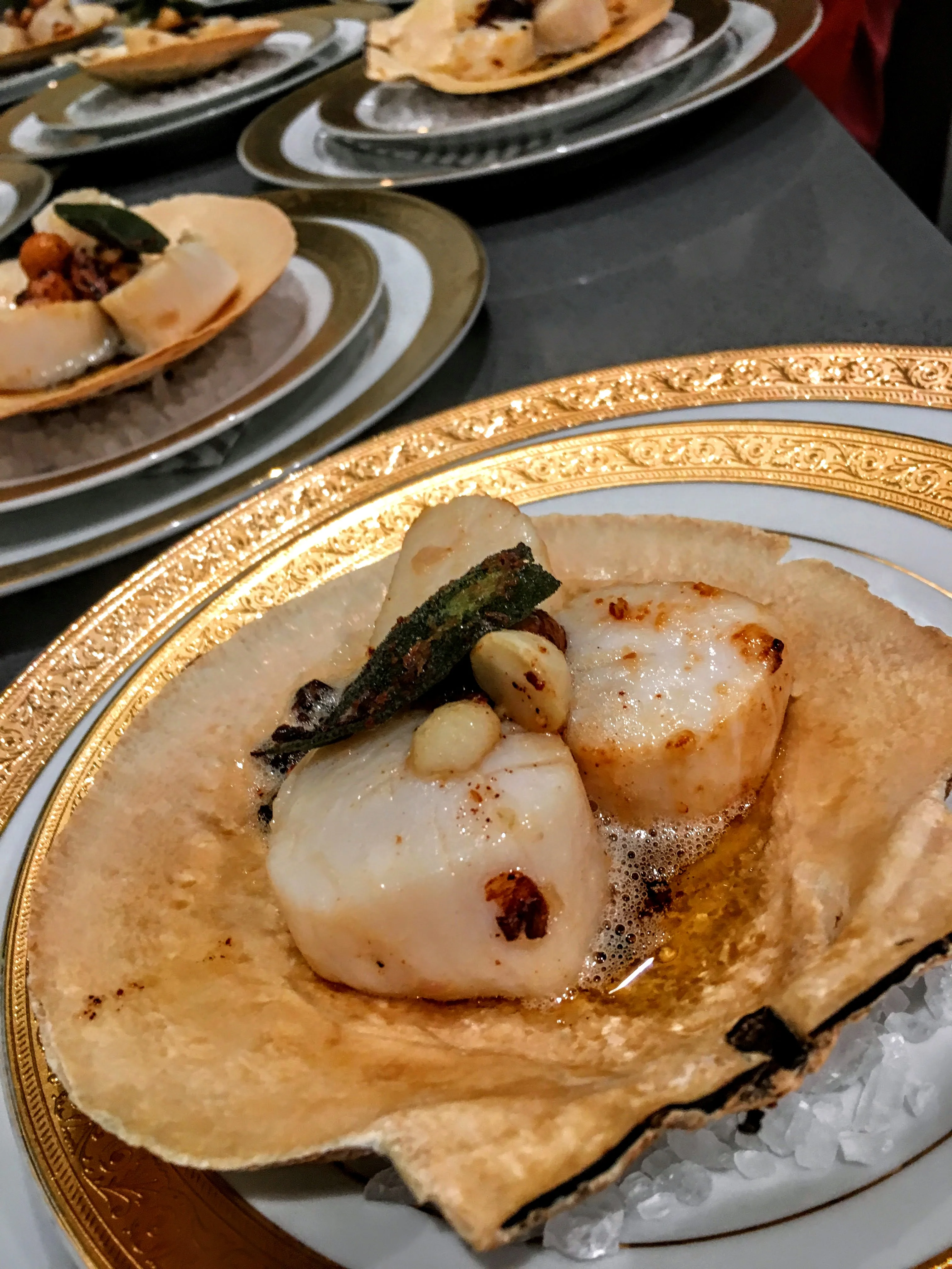Pan-seared sea scallops in their shells with brown butter, sage, and confit garlic at a Napa Valley private dinner